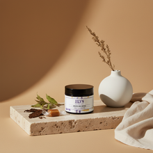 Load image into Gallery viewer, Tobacco Caramel Whipped Shea Butter styled on stone tray with tobacco leaf and caramel props by Jilyn Skincare
