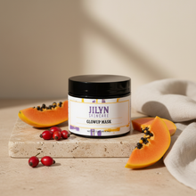 Load image into Gallery viewer, Jilyn Skincare Glowup Mask 2oz jar styled on stone surface with rosehip berries and papaya slices
